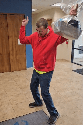 Vinny’s Victory Dance: Individual Supported by Aspire of WNY Reacts to Winning a Jamestown Tarp Skunks Raffle Basket!